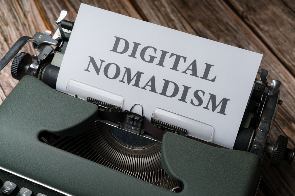 A typewriter with a paper that says digital nomadism
