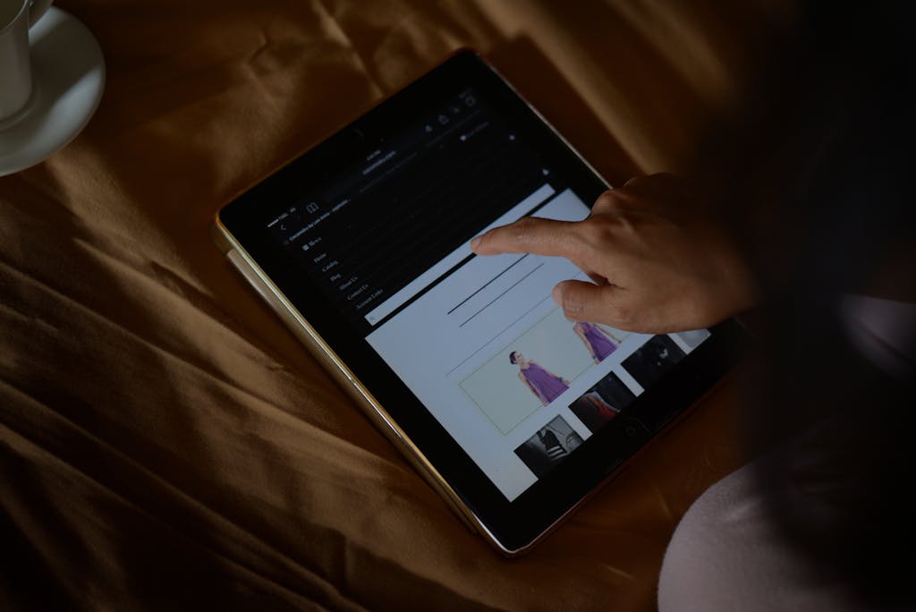 A Person Using Black Tablet