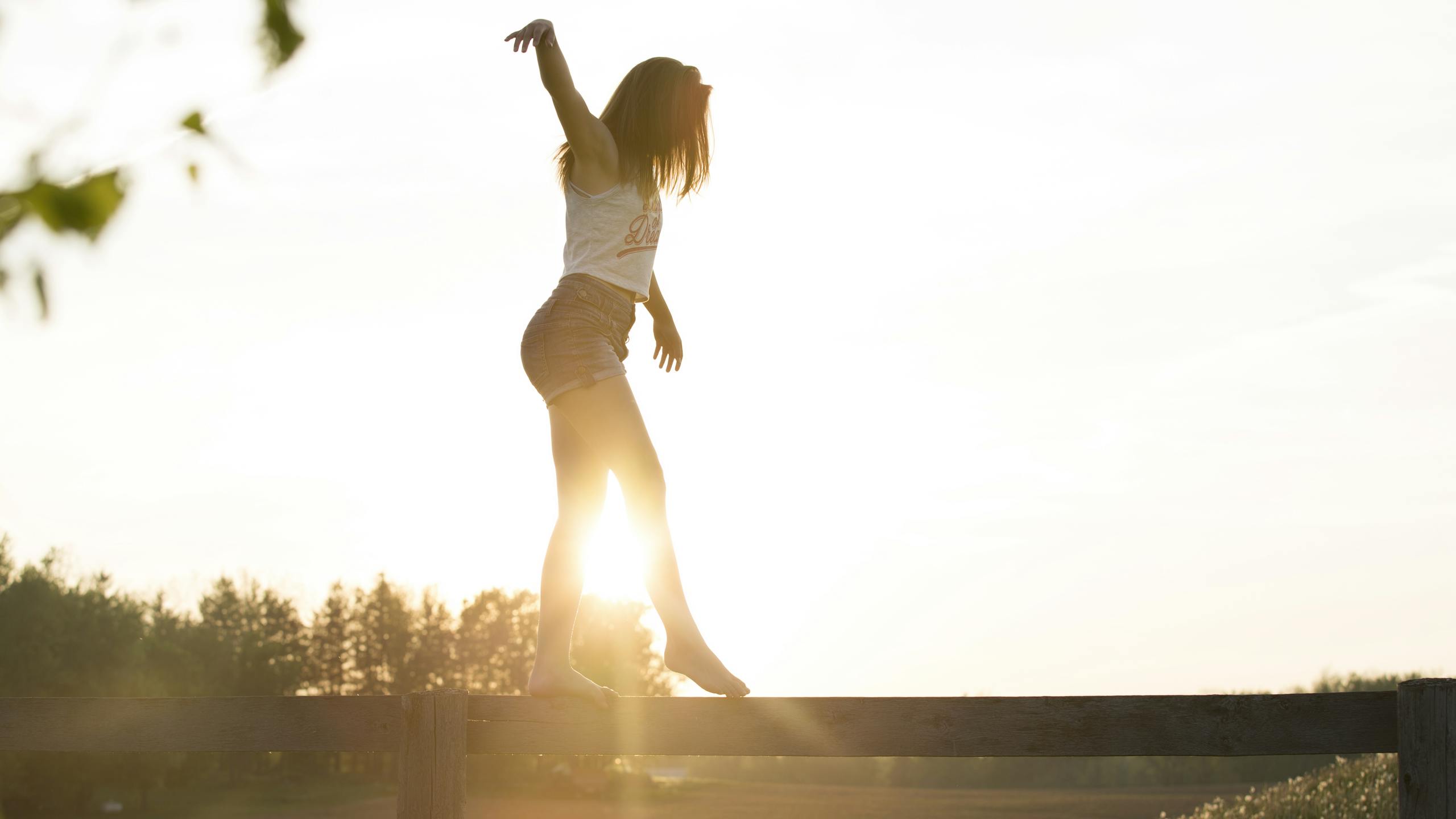 Woman Walking On Fence