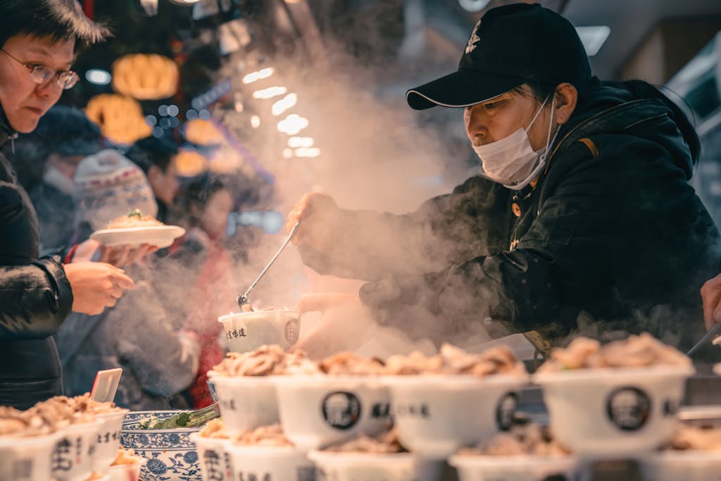 Man Selling Food In Cups