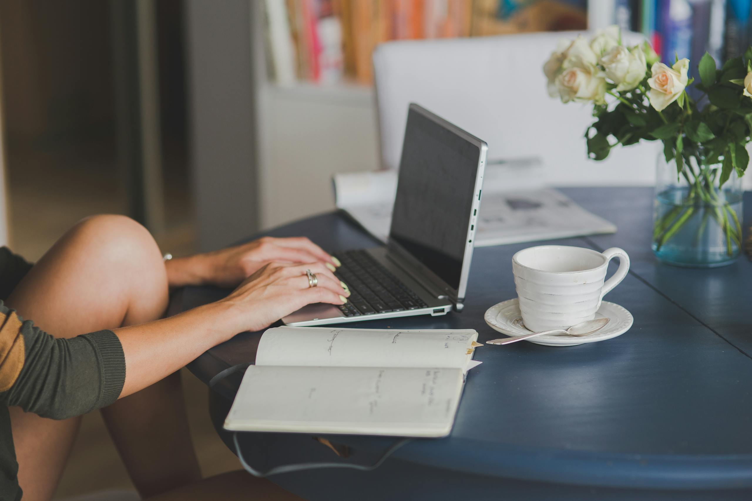 Person Using Black and Silver Laptop Computer