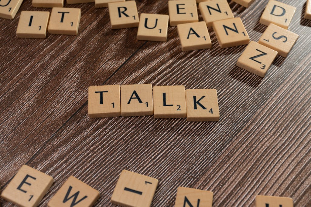 The word talk is spelled out in scrabble letters