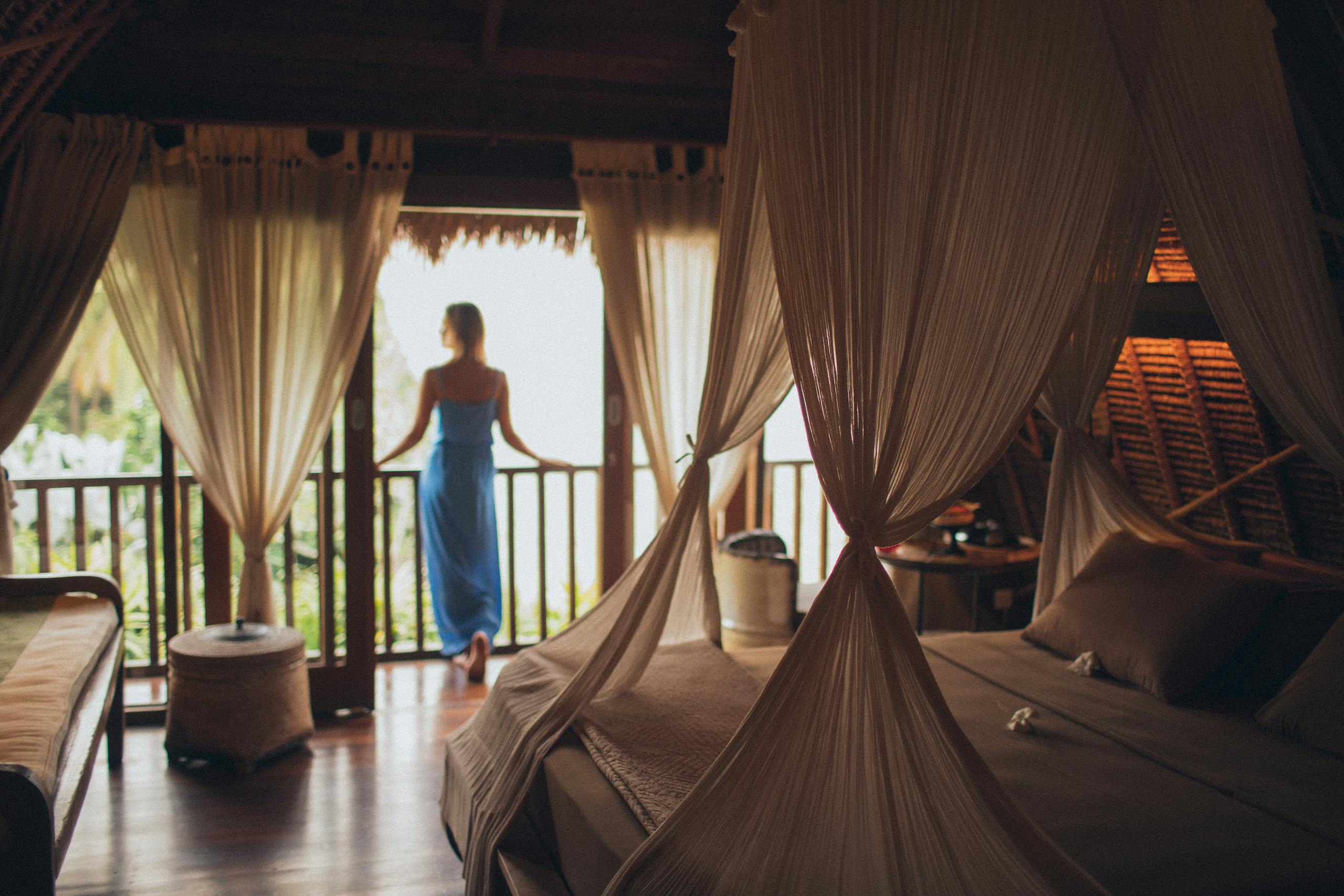 Woman Leaning on Handrail in Room